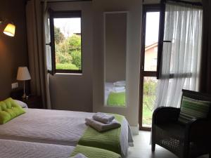 Postel nebo postele na pokoji v ubytování Apartamentos El Hospital de Villahormes