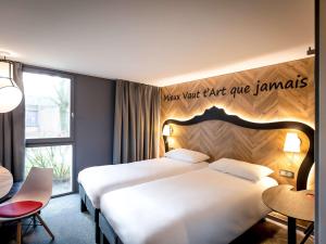 Postel nebo postele na pokoji v ubytování ibis Styles Douai Gare Gayant Expo + 37 fotografií
