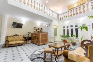 a living room with a couch and a table at Imran Guest House in Samarkand