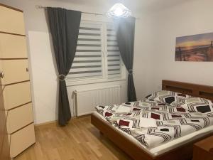 Ένα ή περισσότερα κρεβάτια σε δωμάτιο στο VEA Vienna Apartment