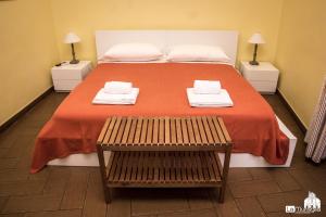 Postel nebo postele na pokoji v ubytování B&B La Muraglia