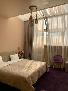 Postel nebo postele na pokoji v ubytování Horizon Hotel + 37 fotografií