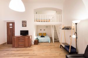a bedroom with a bunk bed and a staircase at Apartment near Wenceslas Square in Prague