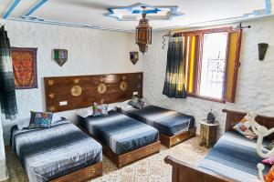 Cama o camas de una habitación en Dar Yakout