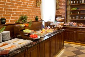 a buffet line with many different types of food at Aparthotel Basztowa in Krakow