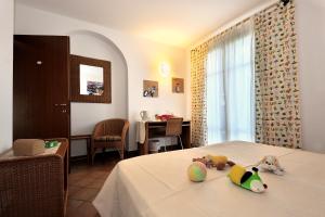 Postel nebo postele na pokoji v ubytování Agriturismo Podere San Michele