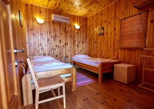 Postel nebo postele na pokoji v ubytování Tikhaya Gavan Hotel