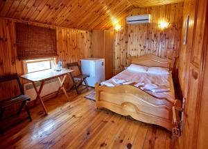 Postel nebo postele na pokoji v ubytování Tikhaya Gavan Hotel