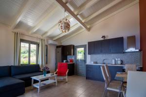 a living room with a couch and a table at Villa Athina in Angón