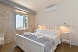 Posteľ alebo postele v izbe v ubytovaní Holiday home Barbarella + 37 fotografií