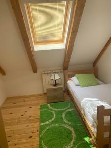 En eller flere senge i et værelse på Turistički centar Vučje