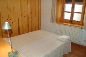 Llit o llits en una habitació de Apartaments Vall Ferrera