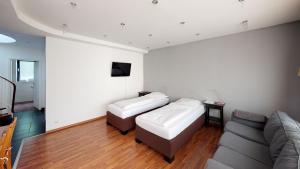 Ένα ή περισσότερα κρεβάτια σε δωμάτιο στο Aurora Apartments