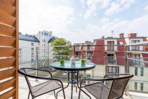 Balkón alebo terasa v ubytovaní Apartamenty Feniks by Noclegi Renters