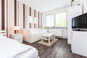 En eller flere senger på et rom på Apartments Köln