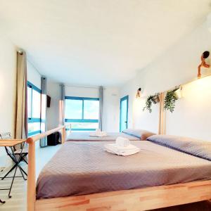 Postel nebo postele na pokoji v ubytování B&B La Nava Suites