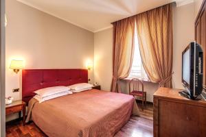 Säng eller sängar i ett rum på Hotel Villafranca