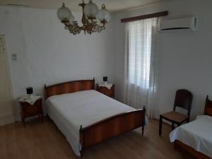 Postel nebo postele na pokoji v ubytování Villa Avli