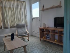 TV a/nebo společenská místnost v ubytování Villa Avli