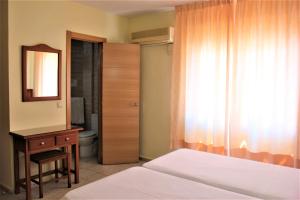 Postel nebo postele na pokoji v ubytování Hotel Cabello