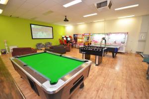 a billiard room with a pool table and other items in it at Tasman Holiday Parks - Merool on the Murray in Echuca