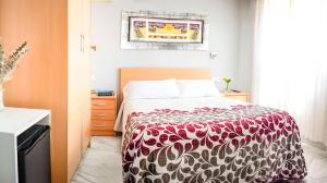 Postel nebo postele na pokoji v ubytování Hotel Albero