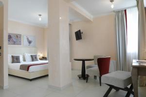 Postel nebo postele na pokoji v ubytování L' Araba Fenice Hotel & Resort