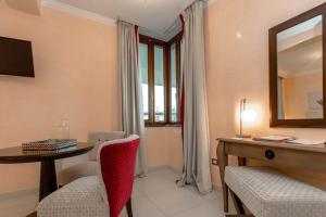 TV a/nebo společenská místnost v ubytování L' Araba Fenice Hotel & Resort