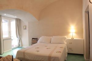 Un pat sau paturi într-o cameră la Masseria Torca - Isca