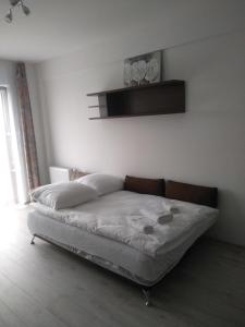 Кровать или кровати в номере Apartament Pogodny