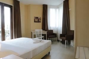 Postel nebo postele na pokoji v ubytování L' Araba Fenice Hotel & Resort