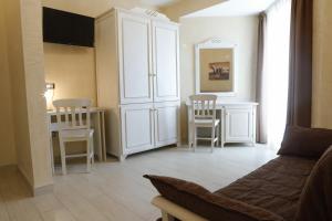 TV a/nebo společenská místnost v ubytování L' Araba Fenice Hotel & Resort
