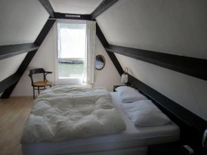 Postel nebo postele na pokoji v ubytování Huisje 59