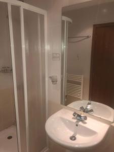 a bathroom with a sink and a shower and a mirror at Studios -Villa Park SV in Borovets +15 photos
