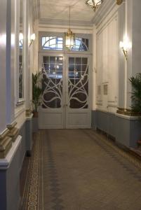 a hallway with a large door in a building at Atlas B&B in Ghent