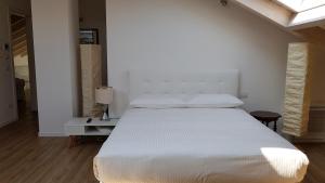 Postel nebo postele na pokoji v ubytování DE PIANTE GUEST