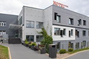 a building with a sign on the side of it at Terra Bella in Biała Podlaska