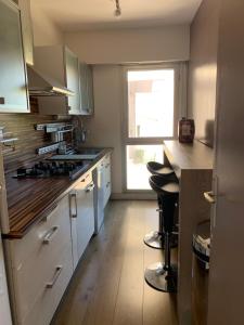 a kitchen with a sink and a stove top oven at PRADO PLAGE in Marseille