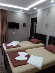 Postel nebo postele na pokoji v ubytování Hotel Mariana