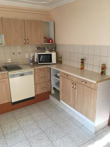 Kuchyňa alebo kuchynka v ubytovaní Stella Apartman