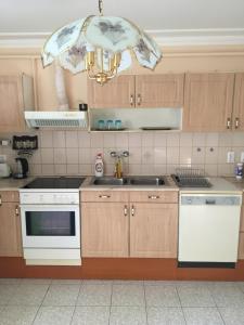 Kuchyňa alebo kuchynka v ubytovaní Stella Apartman