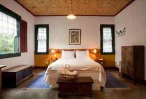 Łóżko lub łóżka w pokoju w obiekcie Pousada d'Oleo de Guignard