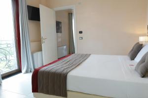 Postel nebo postele na pokoji v ubytování L' Araba Fenice Hotel & Resort