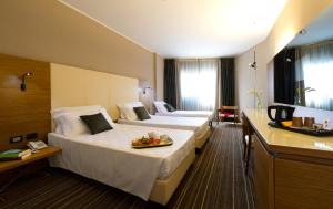 A bed or beds in a room at Hotel D120 Még 37 kép