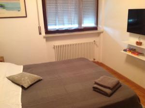 A bed or beds in a room at HOME DI CRISTINA