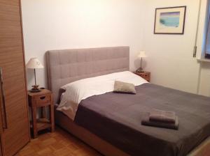 A bed or beds in a room at HOME DI CRISTINA