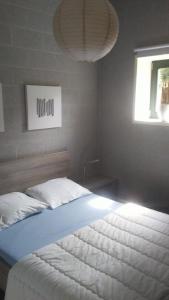 a bedroom with a large bed with a window at vakantieverblijf Nature in Stavelot