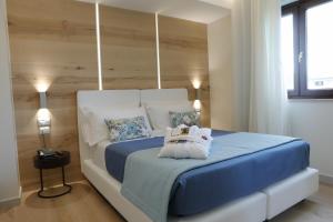 Кровать или кровати в номере Astrea Wellness & Spa