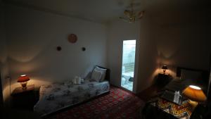 Katil atau katil-katil dalam bilik di Qutlug Qadam Guest House