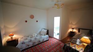 Katil atau katil-katil dalam bilik di Qutlug Qadam Guest House